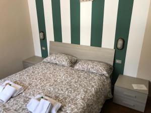 Letto o letti in una camera di La Buca delle Fate Ristorante Albergo
