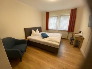 Postel nebo postele na pokoji v ubytování Hotel Janssen