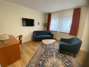 TV a/nebo společenská místnost v ubytování Hotel Janssen