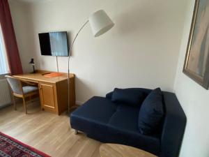 TV a/nebo společenská místnost v ubytování Hotel Janssen