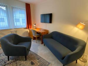 TV a/nebo společenská místnost v ubytování Hotel Janssen