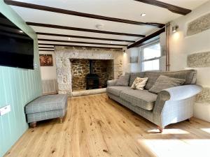 Un lugar para sentarse en Arrowan Common Farm Cottages