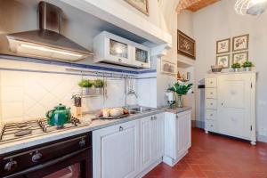 A kitchen or kitchenette at Villa Chianti, your Secret 4 Bedrooms Retreat with View over the Vineyards in Marcialla