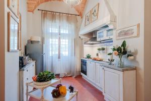 A kitchen or kitchenette at Villa Chianti, your Secret 4 Bedrooms Retreat with View over the Vineyards in Marcialla