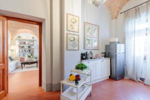 A kitchen or kitchenette at Villa Chianti, your Secret 4 Bedrooms Retreat with View over the Vineyards in Marcialla