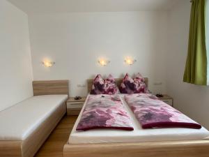 a bedroom with a bed and two night stands at Apartment Schöser by Interhome in Hippach