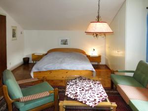 En eller flere senge i et værelse på Holiday Home Reier - BOD130 by Interhome