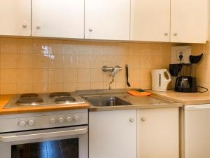 Een keuken of kitchenette bij Apartment Unterkofler - TFN102 by Interhome