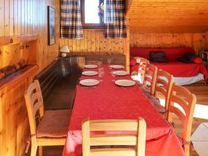 a dining room with a long table and chairs at Apartment Bouleaux I4 by Interhome in Nendaz