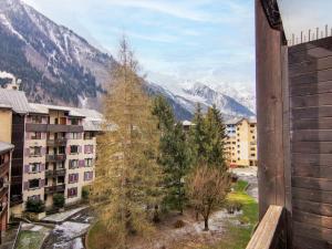 a view of the mountains from a balcony of a building at Apartment Le Grépon-1 by Interhome in Chamonix