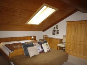 a bedroom with a bed and a skylight at Apartment Lassnig - ARR100 by Interhome in Arriach