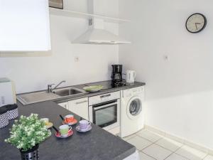 a kitchen with a sink and a washing machine at Apartment Felicita by Interhome in Cros-de-Cagnes