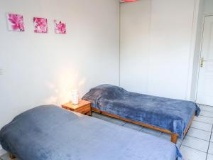 Säng eller sängar i ett rum på Apartment Felicita by Interhome