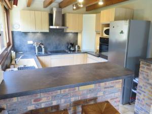 A kitchen or kitchenette at Holiday Home Le Hameau du Point du Jour by Interhome