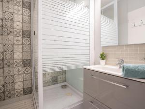 A bathroom at Apartment Plein Soleil by Interhome