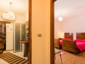 Postel nebo postele na pokoji v ubytování Holiday Home Il Frantoio by Interhome