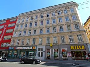 a large building on the corner of a street at Apartment Am Margaretenplatz by Interhome in Vienna