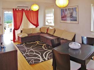 a living room with a couch and a table at Apartment Chantal-4 by Interhome in Rabac