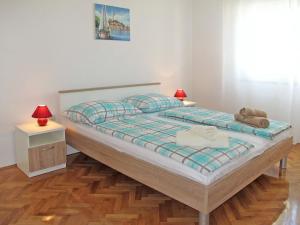 Postel nebo postele na pokoji v ubytování Apartment Luka by Interhome