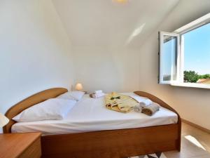Posteľ alebo postele v izbe v ubytovaní Apartment Sani-4 by Interhome