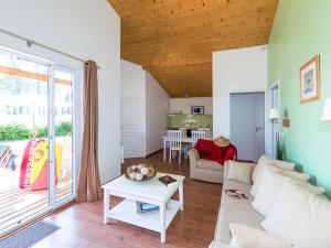 A seating area at Holiday Home Les Cottages du Lac - PNS214 by Interhome