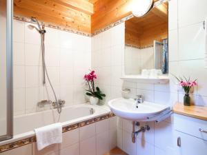 a bathroom with a bath tub and a sink at Holiday Home Sonnleiten-1 by Interhome in Schlierbach