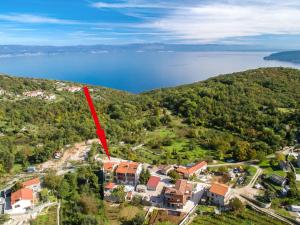 an aerial view of a small town with a red arrow at Apartment Andrea - MOD140 by Interhome in Martina