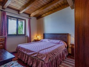 Tempat tidur dalam kamar di Apartment Arte e Cucina-3 by Interhome