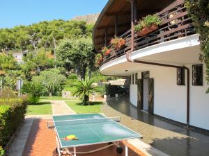 a ping pong table in front of a building at Apartment Costa di Kair ed Din-3 by Interhome in Sperlonga
