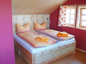 a bedroom with a large bed in a room at Chalet Weitsicht by Interhome in Lichtenhain