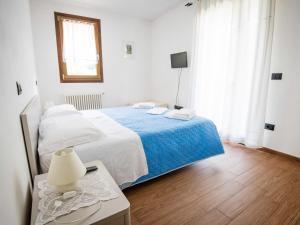 Postel nebo postele na pokoji v ubytování Apartment Sergio by Interhome