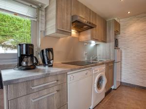 a kitchen with a washer and dryer at Apartment MEN DU-1 by Interhome in Carnac