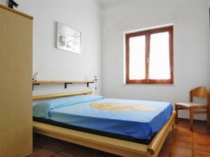 Posteľ alebo postele v izbe v ubytovaní Apartment Reale Marina - REI208 by Interhome