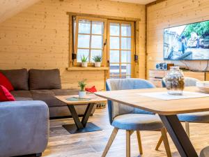 a living room with a couch and a table at Apartment Schmalzenhof by Interhome in Hofstetten
