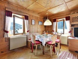 a dining room with a table and chairs at Apartment Luca by Interhome in Ortisei
