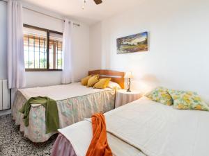 Posteľ alebo postele v izbe v ubytovaní Holiday Home El Zapo by Interhome