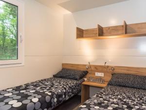 Posteľ alebo postele v izbe v ubytovaní Holiday Home Klen 1 by Interhome