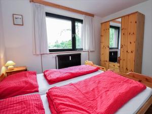 Apartment Spatzennest - Top 7 by Interhome tesisinde bir odada yatak veya yataklar