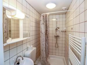 a bathroom with a shower and a sink at Apartment Spatzennest - Top 7 by Interhome in Grünau im Almtal