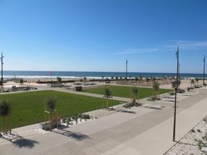a park near the beach with the ocean in the background at Apartment Grand Pavois-4 by Interhome in Mimizan-Plage