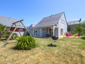 a house with a grill in the yard at Holiday Home Pen-Guen by Interhome in Dinard