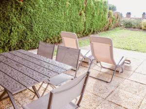 a group of chairs and a table and chairsitures at Villa Casa Bellevue by Interhome in Grandvaux