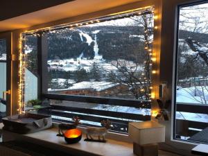 a window with a view of a snow covered mountain at Apartment Monte Grau Top 5 by Interhome in Bad Gastein