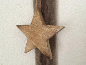 a wooden star hanging on a wall at Apartment Bergfreude Kuonen by Interhome in Saas-Grund