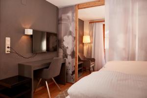 Llit o llits en una habitació de Dà Ingo - Apartments & More