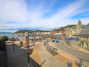 a view of a town with a river and a street at Apartment Seaside Apartment by Interhome in Oban