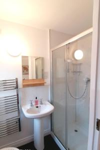 a bathroom with a sink and a shower at Apartment Seaside Apartment by Interhome in Oban