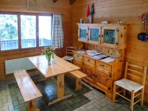 A restaurant or other place to eat at Holiday Home Ferienhaus Gommiswald by Interhome