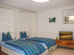 Ένα ή περισσότερα κρεβάτια σε δωμάτιο στο Apartment Appartamento 2- Giardino by Interhome