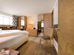 Postel nebo postele na pokoji v ubytování Apartment Chesa Piz Mezdi - St- Moritz by Interhome